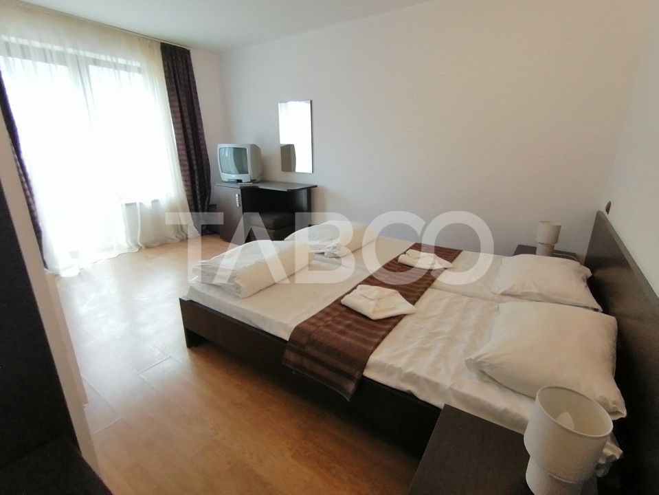 Pensiune 13 camere 16 bai sauna piscina si teren 1565 mp Cisnadioara – fotografia 27 din 42