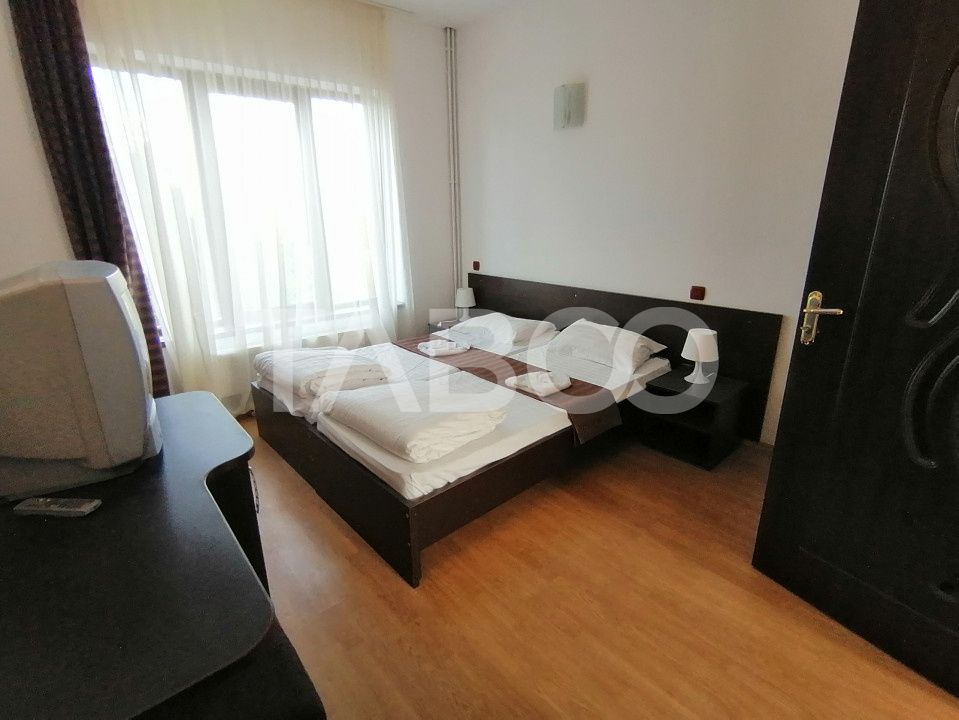 Pensiune 13 camere 16 bai sauna piscina si teren 1565 mp Cisnadioara – fotografia 31 din 42