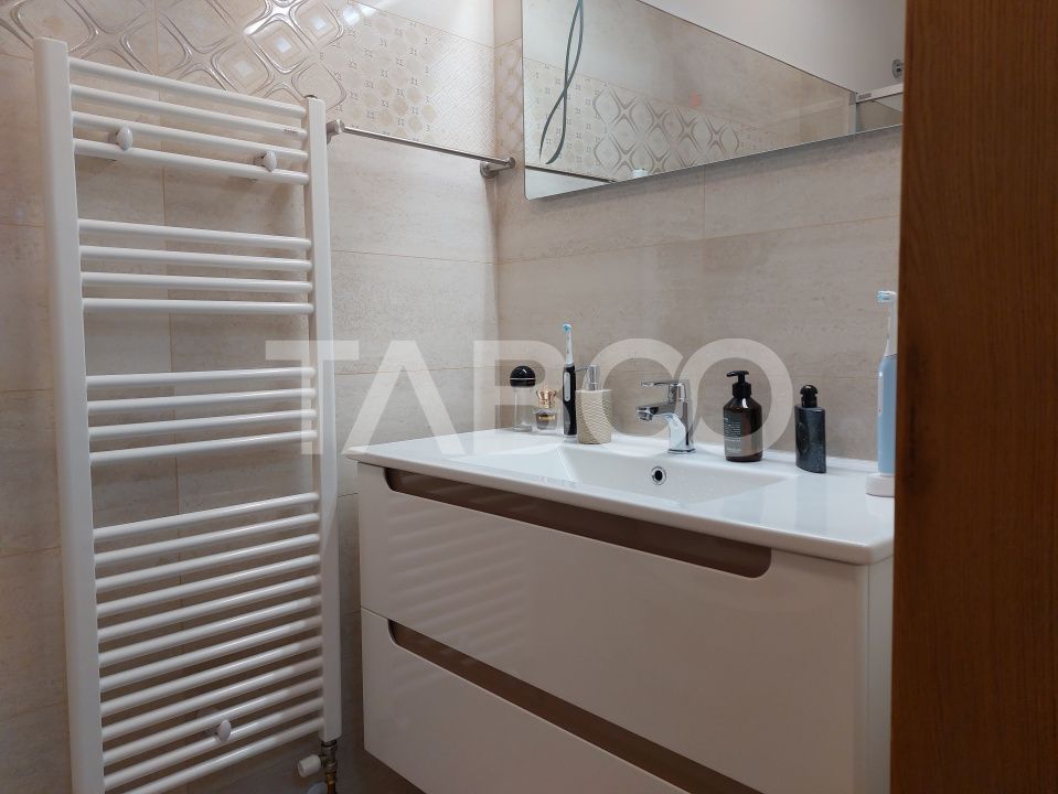Casa 109 mp 4 camere pivnita terasa loc parcare curte comuna Cisnadie – fotografia 23 din 24