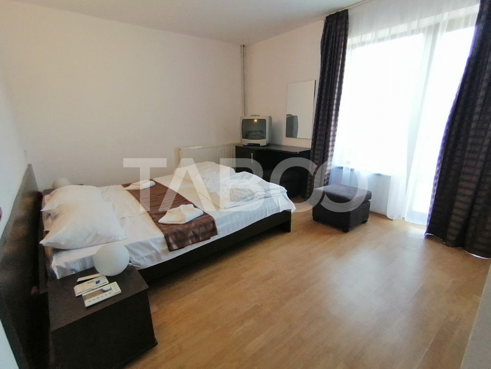 Pensiune 13 camere 16 bai sauna piscina si teren 1565 mp Cisnadioara – fotografia 14 din 42