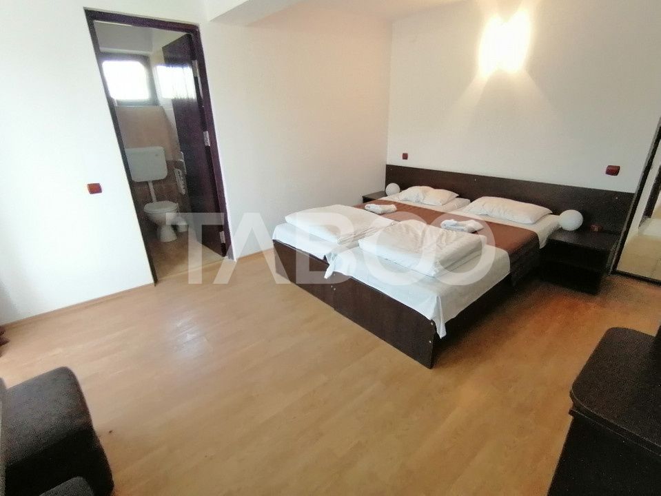 Pensiune 13 camere 16 bai sauna piscina si teren 1565 mp Cisnadioara – fotografia 13 din 42