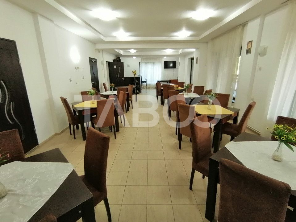 Pensiune 13 camere 16 bai sauna piscina si teren 1565 mp Cisnadioara – fotografia 39 din 42