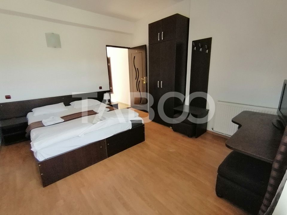 Pensiune 13 camere 16 bai sauna piscina si teren 1565 mp Cisnadioara – fotografia 34 din 42