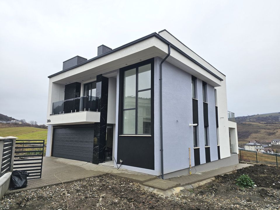 Proprietate moderna cu design exterior deosebit in Popesti – fotografia 1 din 21