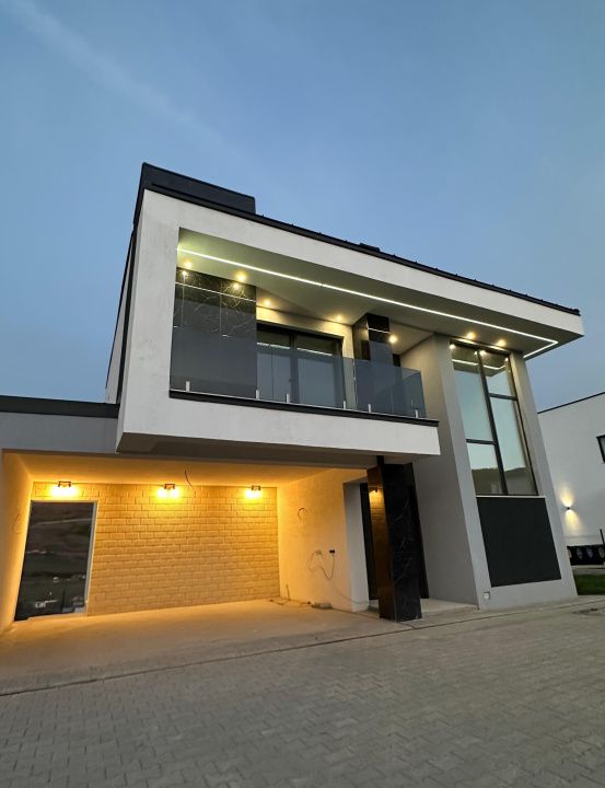 Proprietate moderna cu design exterior deosebit in Popesti – fotografia 8 din 21