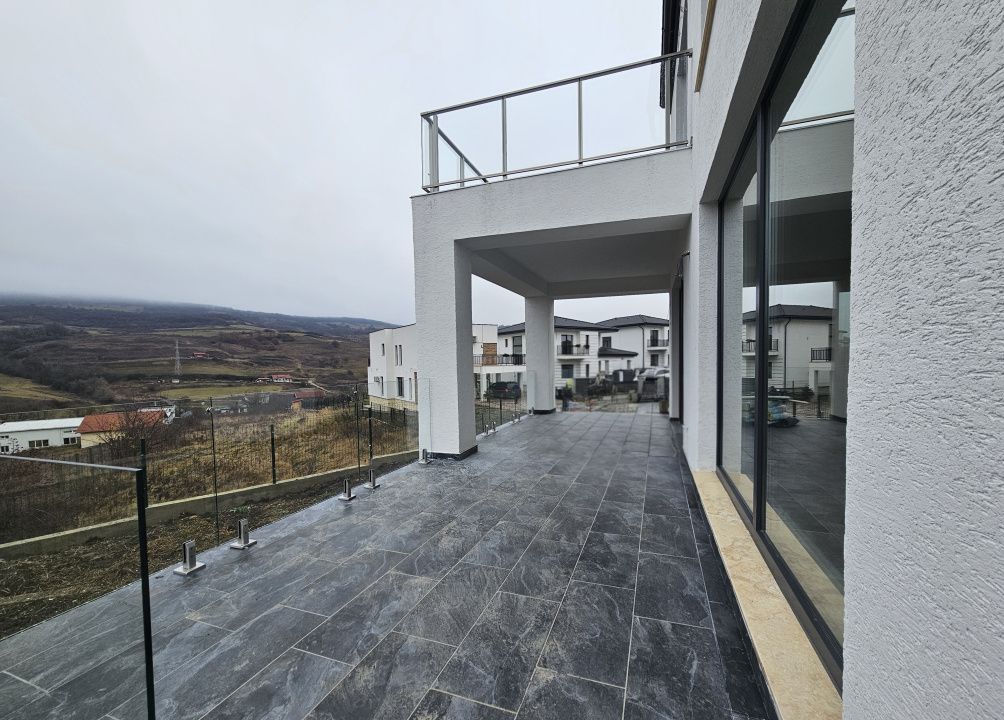 Proprietate moderna cu design exterior deosebit in Popesti – fotografia 6 din 21