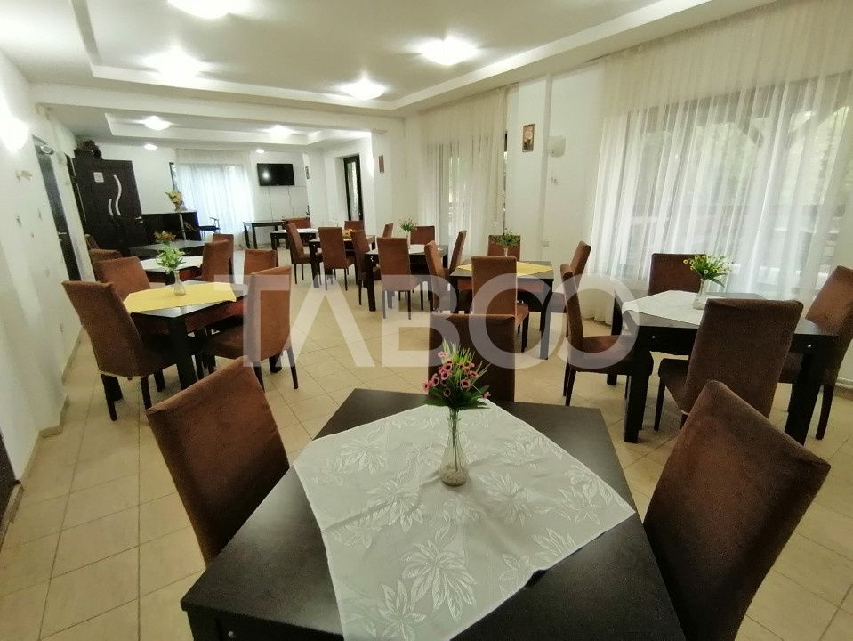 Pensiune 13 camere 16 bai sauna piscina si teren 1565 mp Cisnadioara – fotografia 16 din 42