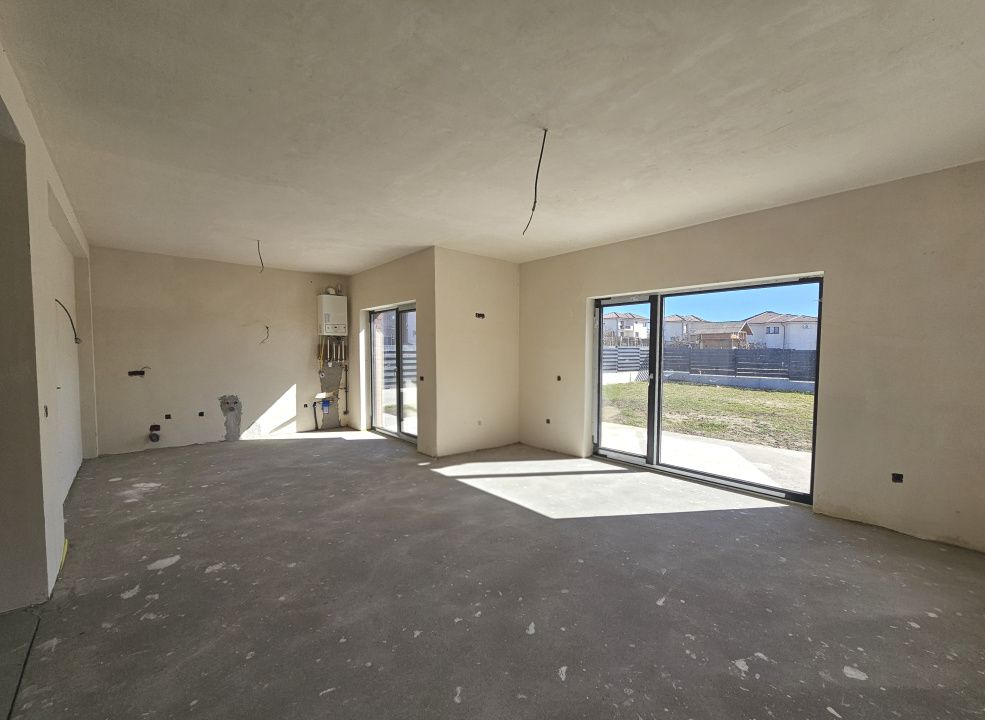 Locuinta moderna cu design cubic si curte plana in Dezmir – fotografia 5 din 16