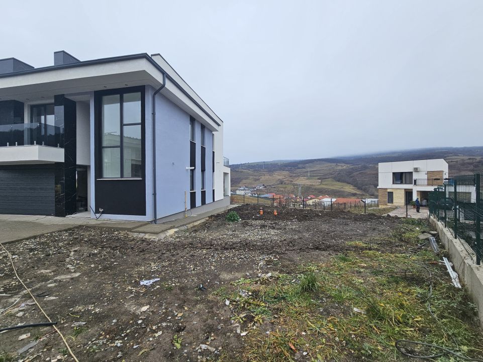 Proprietate moderna cu design exterior deosebit in Popesti – fotografia 4 din 21