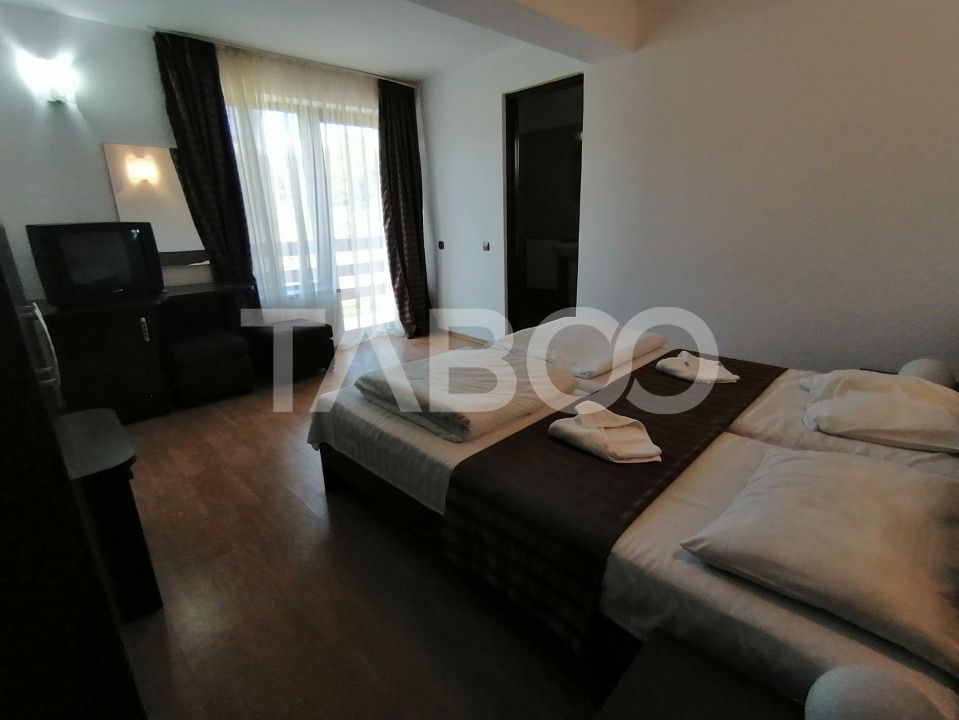 Pensiune 13 camere 16 bai sauna piscina si teren 1565 mp Cisnadioara – fotografia 18 din 42