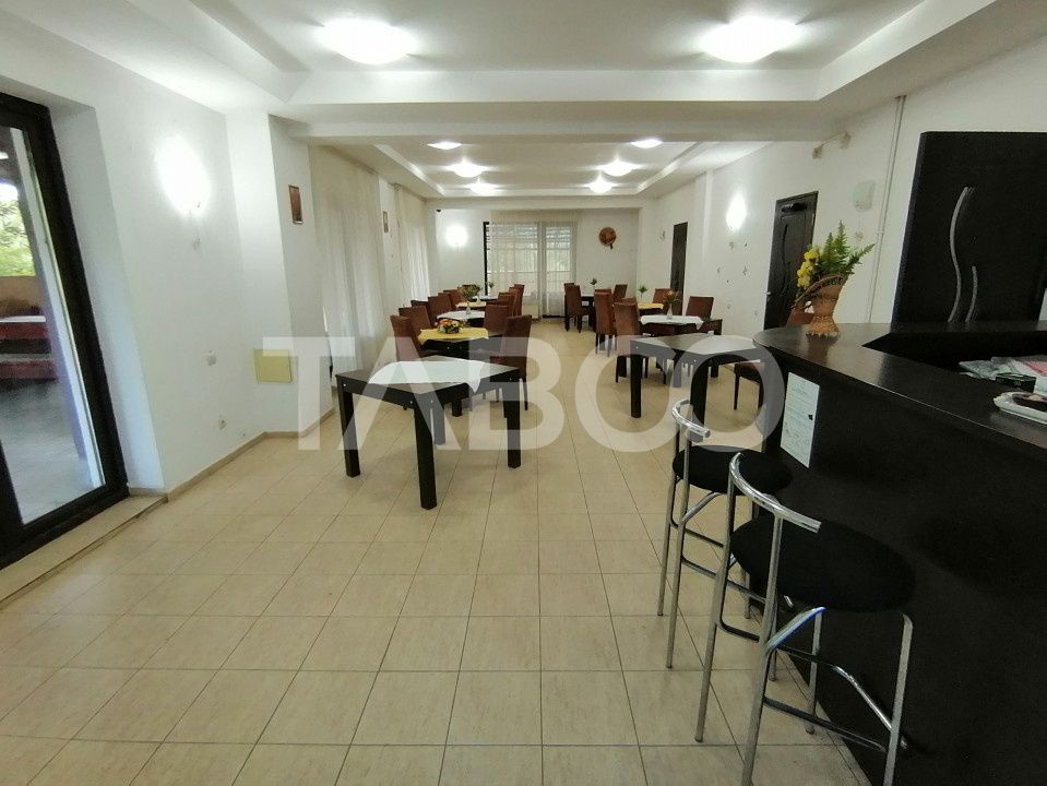 Pensiune 13 camere 16 bai sauna piscina si teren 1565 mp Cisnadioara – fotografia 37 din 42